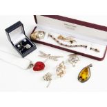 A collection of silver and gem set jewellery, including a paste set dragonfly pendant, an amber