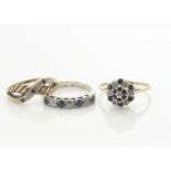 A 9ct gold sapphire and diamond cluster ring, a 9ct gold sapphire and diamond crossover ring and a