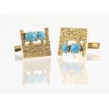 A pair of continental yellow metal and turquoise cufflinks, the square pierced fronts with two