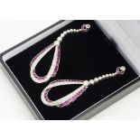 A pair of platinum, ruby and diamond drop earrings, in the Belle Epoque style, the loops with
