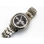 A c1970s Seiko 5 automatic stainless steel gentlman~s wristwatch, 36mm case, dial with batons, day