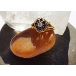 A sapphire and diamond 18ct gold contemporary dress ring, the brilliant cut diamond in claw