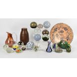 A small group of 20th Century glass paperweights, including an angel fish, a stone charger also