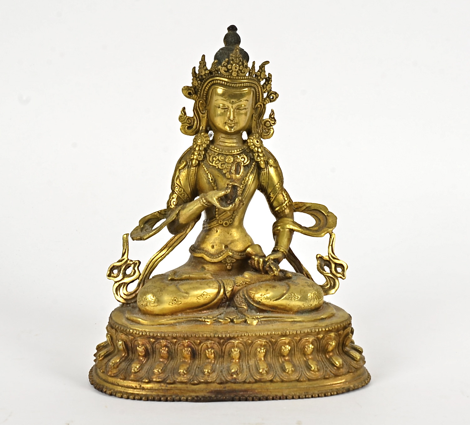 A late 19th Century metalwork Tibetan Buddha, seated in the lotus position, height 21cm