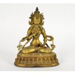 A late 19th Century metalwork Tibetan Buddha, seated in the lotus position, height 21cm
