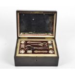 A 19th Century ebony inlaid tortoiseshell and brass sewing box, the hinge lid with mirrored