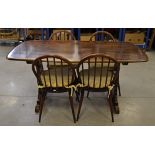 A stained dark wood Ercol style dining room suite, consisting of two carvers, two highback chairs