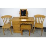 Five contemporary pine items of furniture, comprising a knee hole desk with three short drawers to