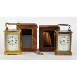 Two late 19th Century brass carriage clocks, both with white enamel dials with Roman numerals, one