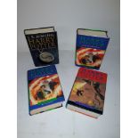 Harry Potter Volumes by JK Rowling, four volumes all with dust jackets published by Bloomsbury,