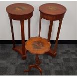 A pair of Sheraton revival work tables, the hinged tops to reveal fitted interiors, supported upon