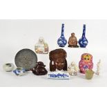 An assortment of Asian works of art, including a pair of overglaze polychrome laughing Buddhas,
