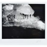 A limited edition photograph, depicting ice in black and white, indistinct signature, 5/50, framed