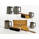 Nine English pewter mugs, assorted sizes, together with five wooden-backed shoe brushes, two