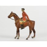 A spelter figure of a huntsman, mounted on his horse, the tail a/f, height 10cm