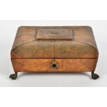 An 18th Century tortoiseshell cushion shaped casket, with gilt metal floral and ball feet, on a