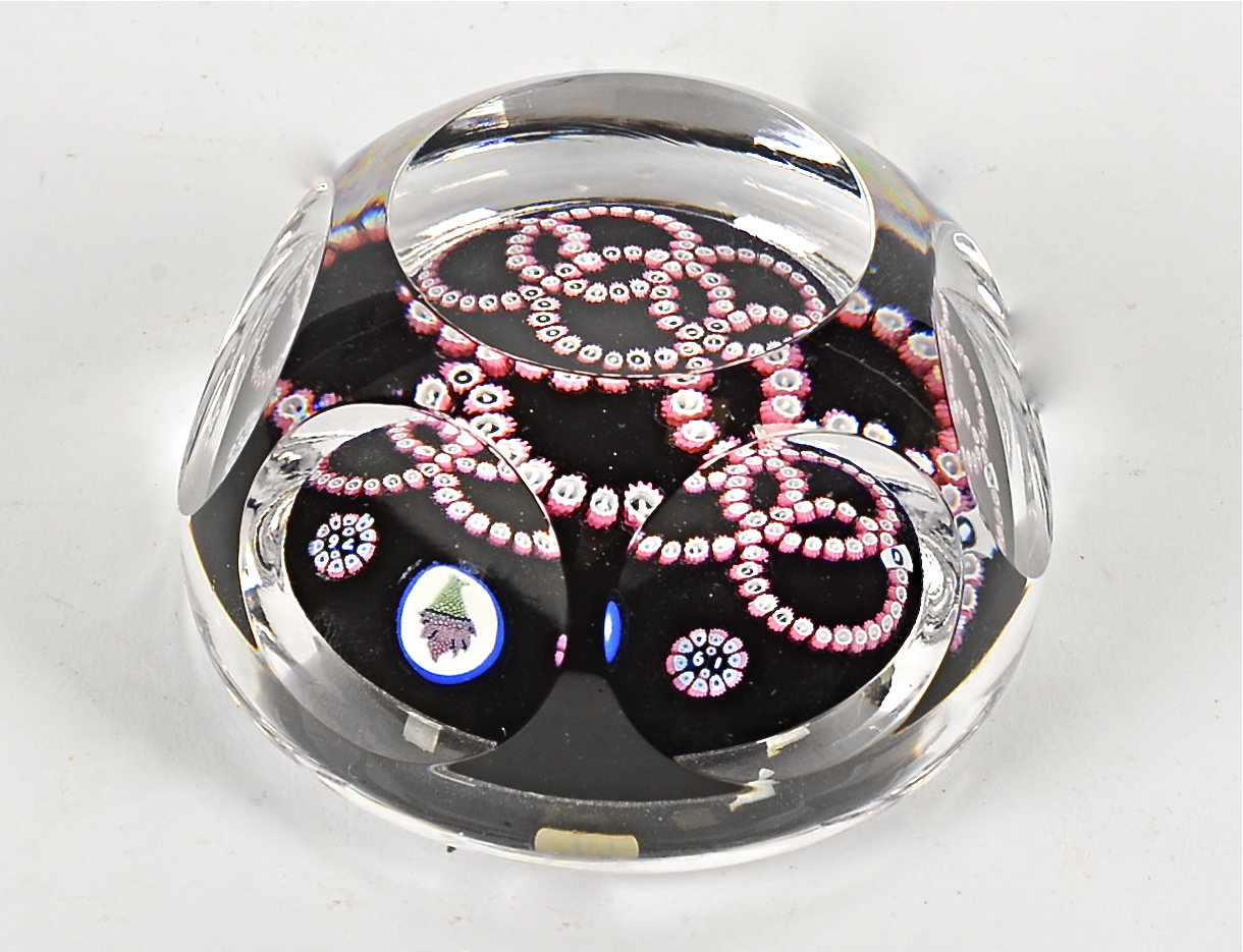 A Whitefriars five ringed glass paperweight’ with target design and faceted body, approximate