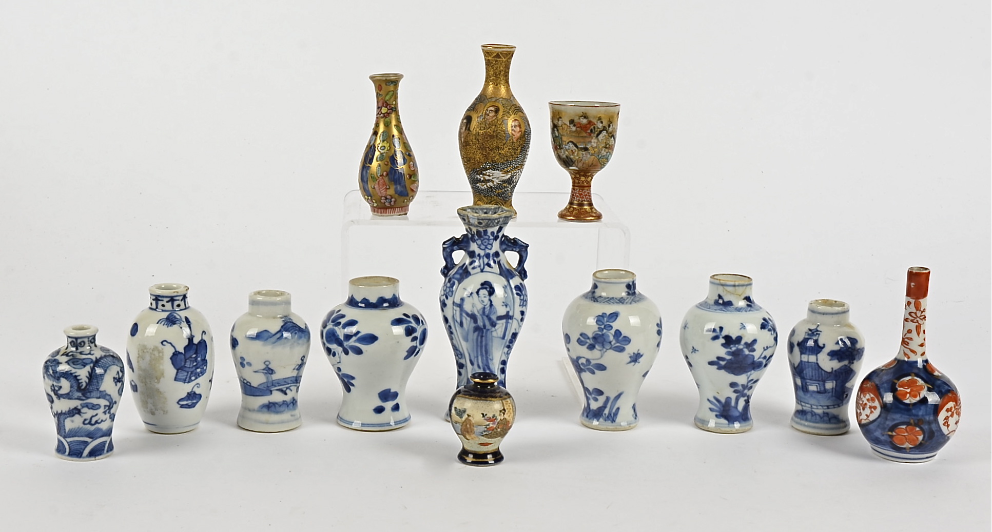 A quantity of Chinese and Japanese bottles, one of lobed form with long Eliza pattern, height