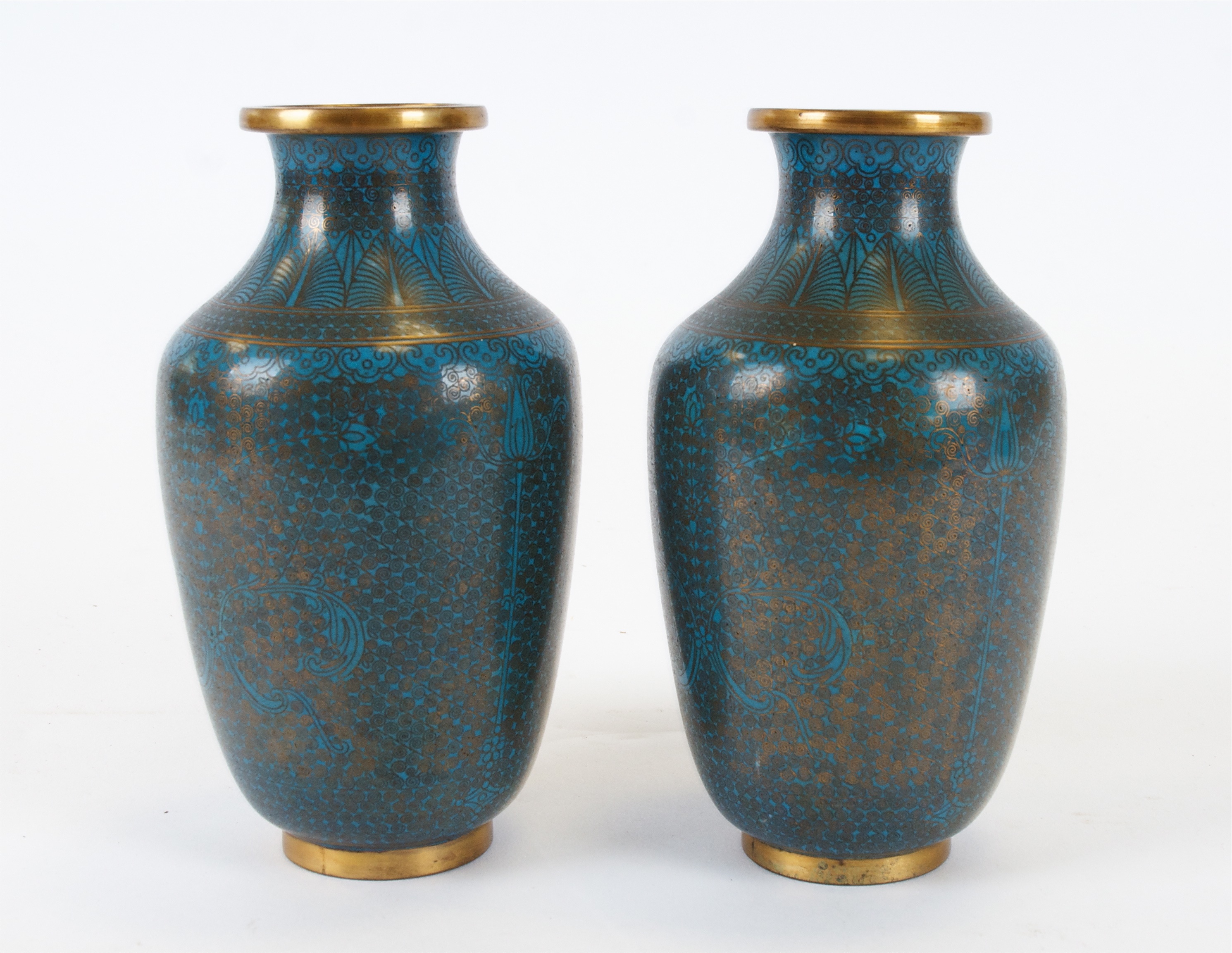 A pair of Asian cloisonné enamel vases, with uniform turquoise colouring, the intricate metalwork