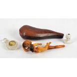 A Belle Epoque carved Meerschaum pipe, in the form of a curvaceous nude with floral bonnet, cased,