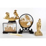 Several Oriental cork items and other objects, to include a pagoda and bridge landscape in a
