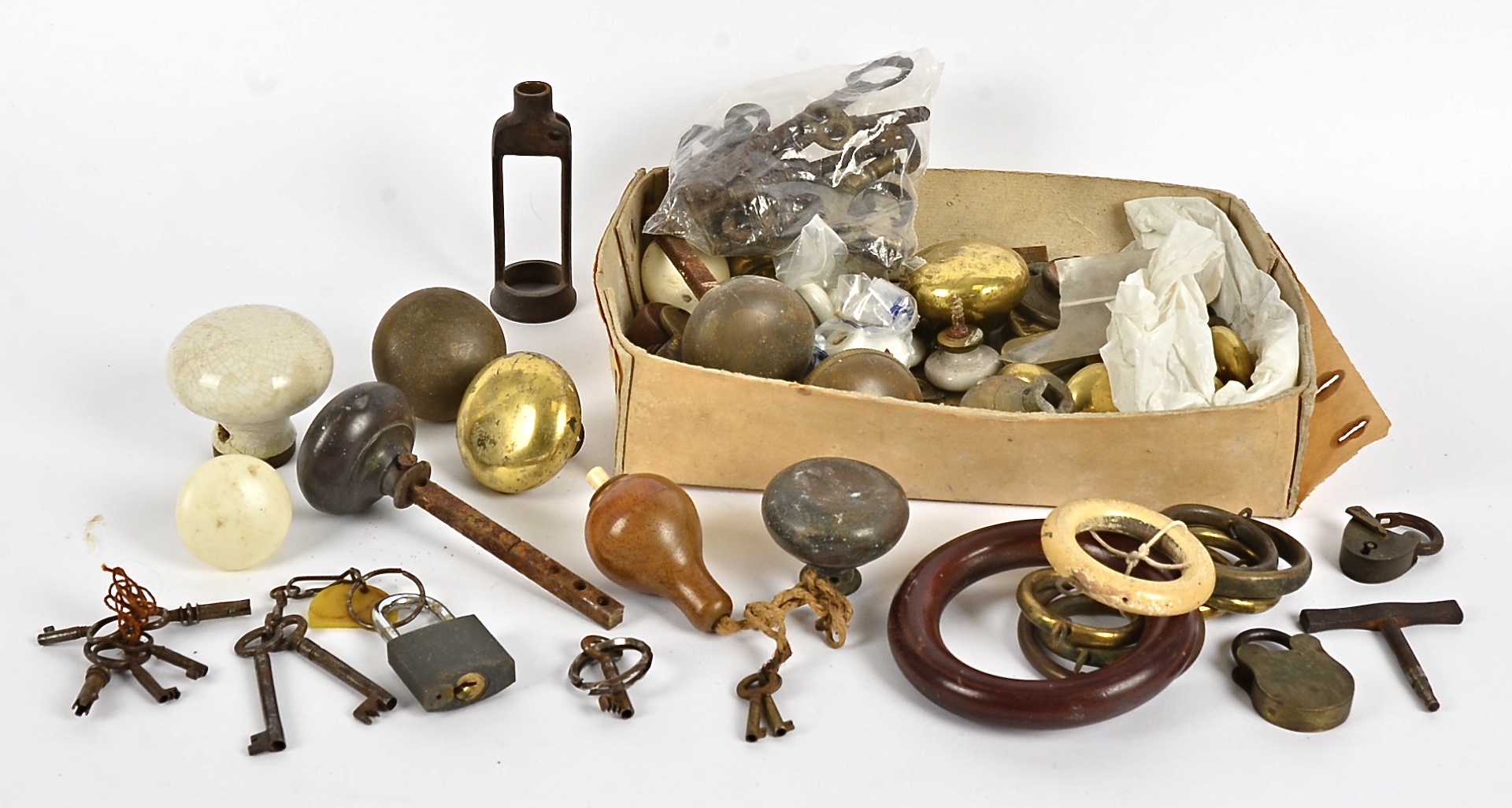 An assortment of 19th & 20th Century locks and door knobs, brass, wooden and ceramic examples,