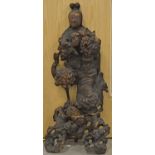 An early 19th Century Chinese root carving, modelled as an immortal standing clutching a root in