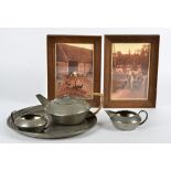 A Tudric pewter bachelor's tea set, consisting of teapot, jug and sugar bowl on tray, diameter of