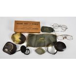 A collection of various early 20th Century spectacles, comprising a monocle with yellow metal frame,