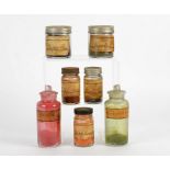 A group of Victorian novelty bottles, with original contents, colourful powders and pigments from