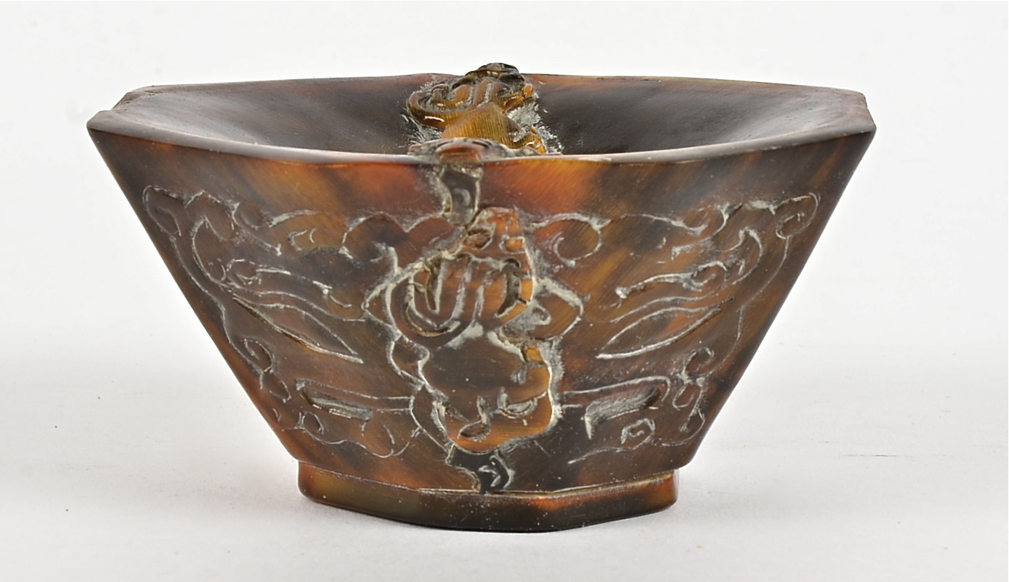 A 19th Century Chinese rhinoceros horn libation cup, the design comprising four mythical beasts - Image 2 of 2