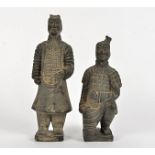 Two Chinese terracotta tomb figures, one standing and one crouching on one knee, heights 27cm and