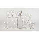 A Webb Corbett glass licquor set, comprising a cylindrical decanter, four glasses and another larger