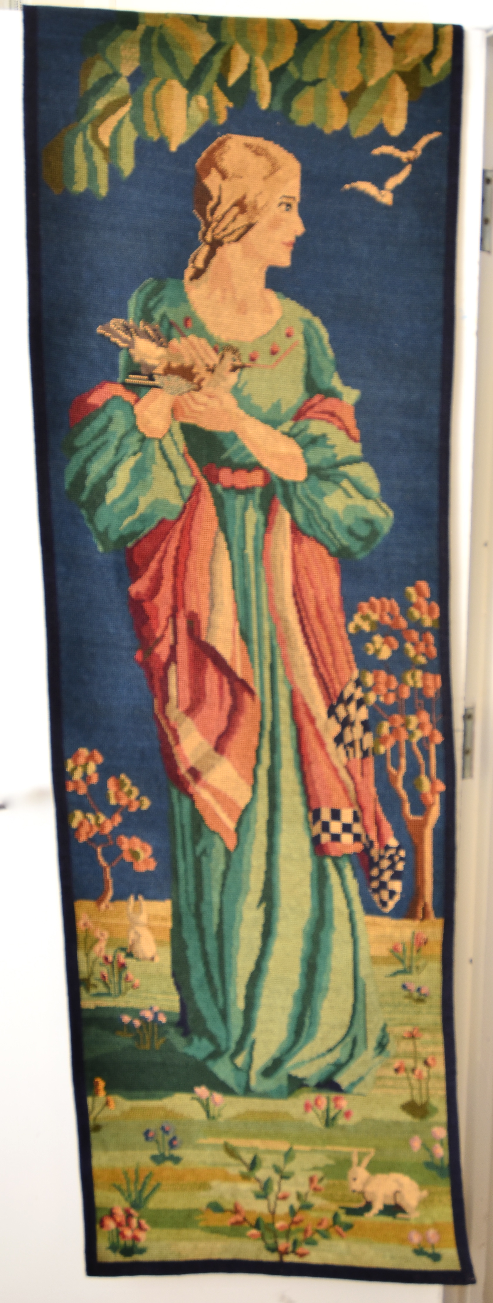 A pair of late 19th/early 20th Century Berlin needlework wall hangings, each depicting a woman in - Image 3 of 4