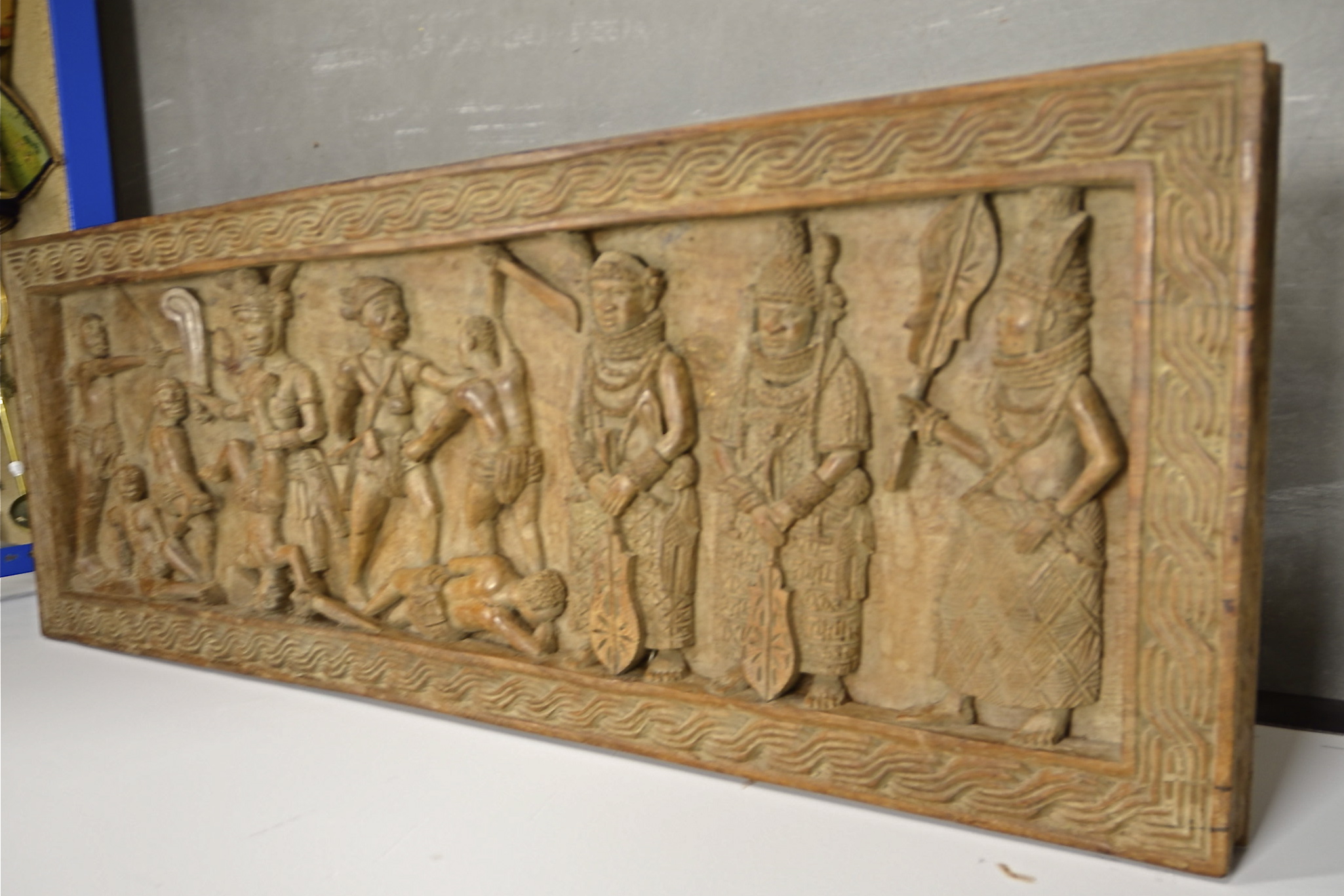 A Benin table and coffer lid, 155cm x 45cm x 52cm, with carved decoration (2) - Bild 2 aus 5