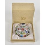 A large Clichy eighteen canned paperweight, with tightly packed millefiori canes and short lengths