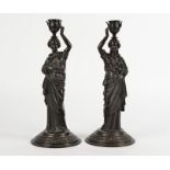 A pair of Verlag Bei Zimmermann Neo-Classical spelter candlestick holders, taking the form of female