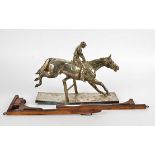 After Fritz Diller (1875-1945) a silver plated model of a horse and jockey clearing a hurdle,