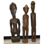 Two Baule figures and a Senufo figure, Ivory Coast, tallest 100cm (3)