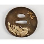 A late 19th/early 20th Century Japanese tsuba, with applied metalwork decoration, taking the form of