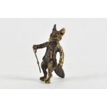 A miniature bronze figure of Mr Todd, dressed in gentleman's attire, height 3.5cm,