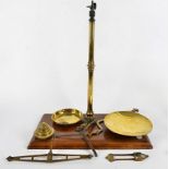 A set of brass scales, on a wooden base, height 64cm
