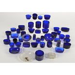 A large quantity of blue glass liners, in assorted shapes and sizes (55+)