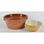A large terracotta crock pot, length 52cm, together with a large mixing bowl, (2)