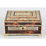 A bone and tortoiseshell box, of Indian origin, raised on four feet, the interior with mirror and