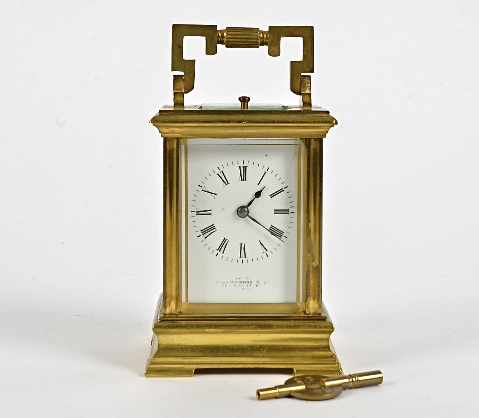 A late 19th Century French brass carriage clock, white enamel dial with Roman numerals, inscribed '