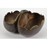 An antique coco-de-mer (lodoicea maldivica) seed pod, carved to form a two-division basket with