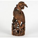 A 19th Century Chinese bamboo carving of a waterbird amongst flowers, height 33cm