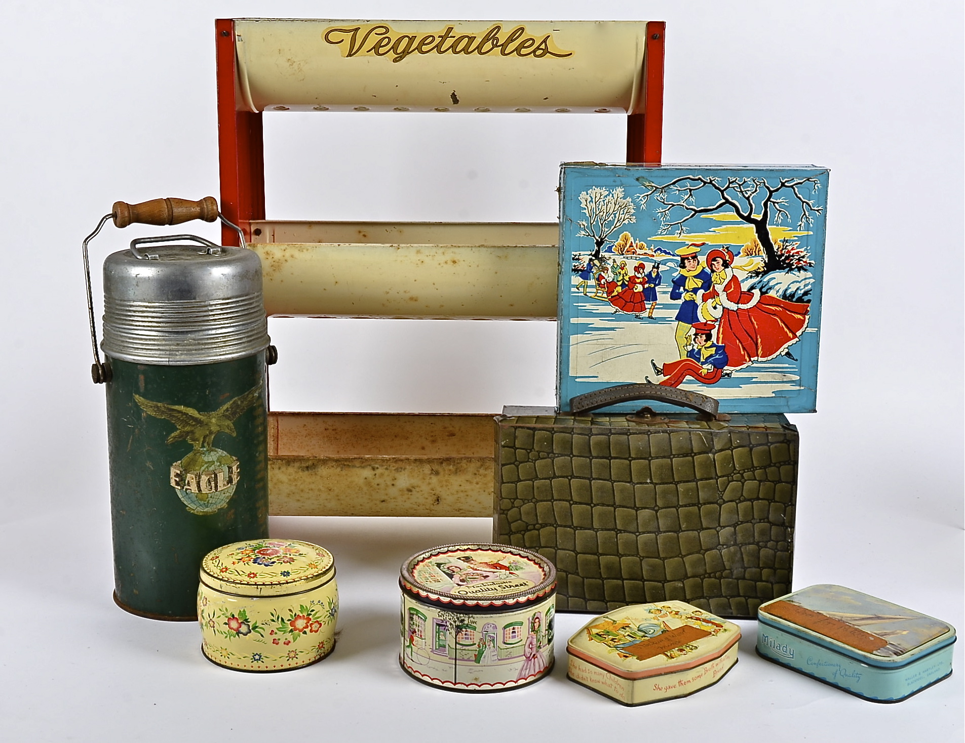 A 20th Century tin vegetable stand, height 51cm, together with several collectable tins, including