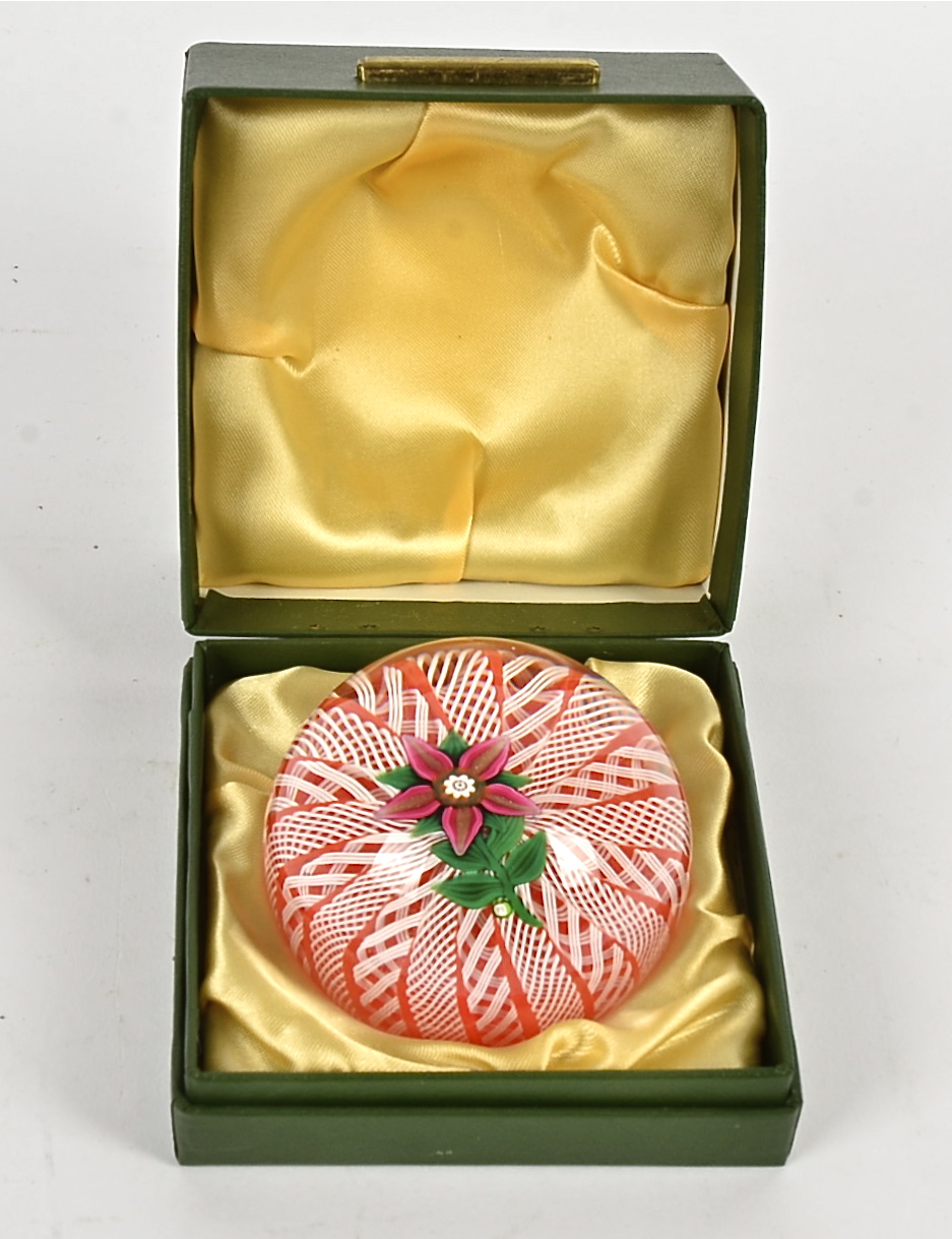A Paul Ysart paperweight, with encased Dalia within a latticino frame, pontil mark to base,